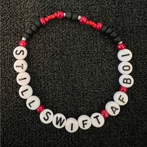 Taylor Swift still swift af boi friendship bracelet
